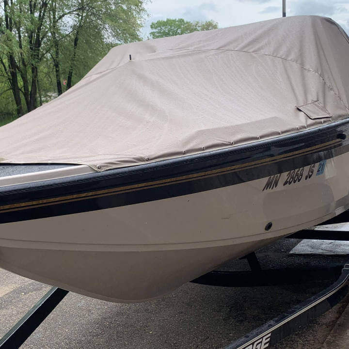 An off-white boat cover on a boat