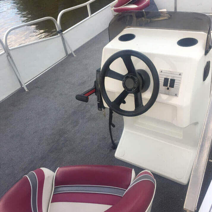 Pontoon with a dark red seat